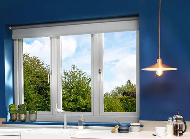 Blue kitchen with large windows