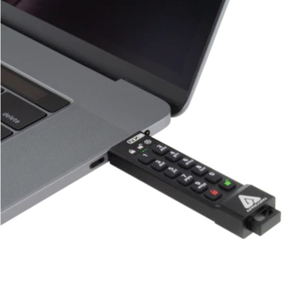 A USB Flash Drive with C-type connector inserted into a laptop