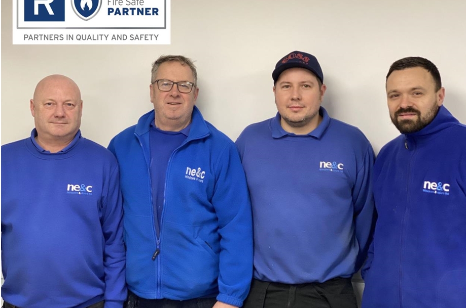 Four men in blue workwear