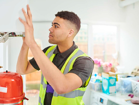 A tradesman working inside a home