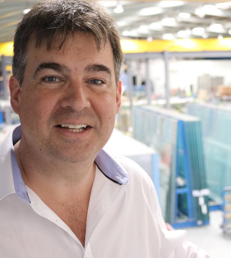 A man inside a glass factory