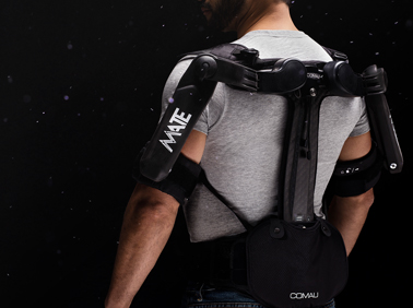 Rear view of a man wearing te MATE-XT exoskeleton