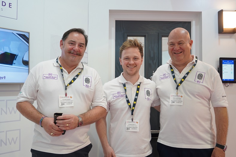 3 men in white t shirts