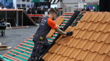 A man doing a roofing demonstarion