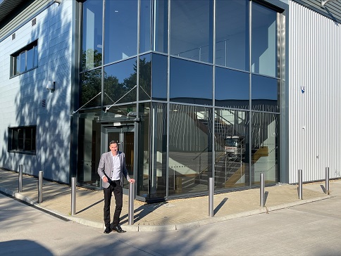 A man in front of a building