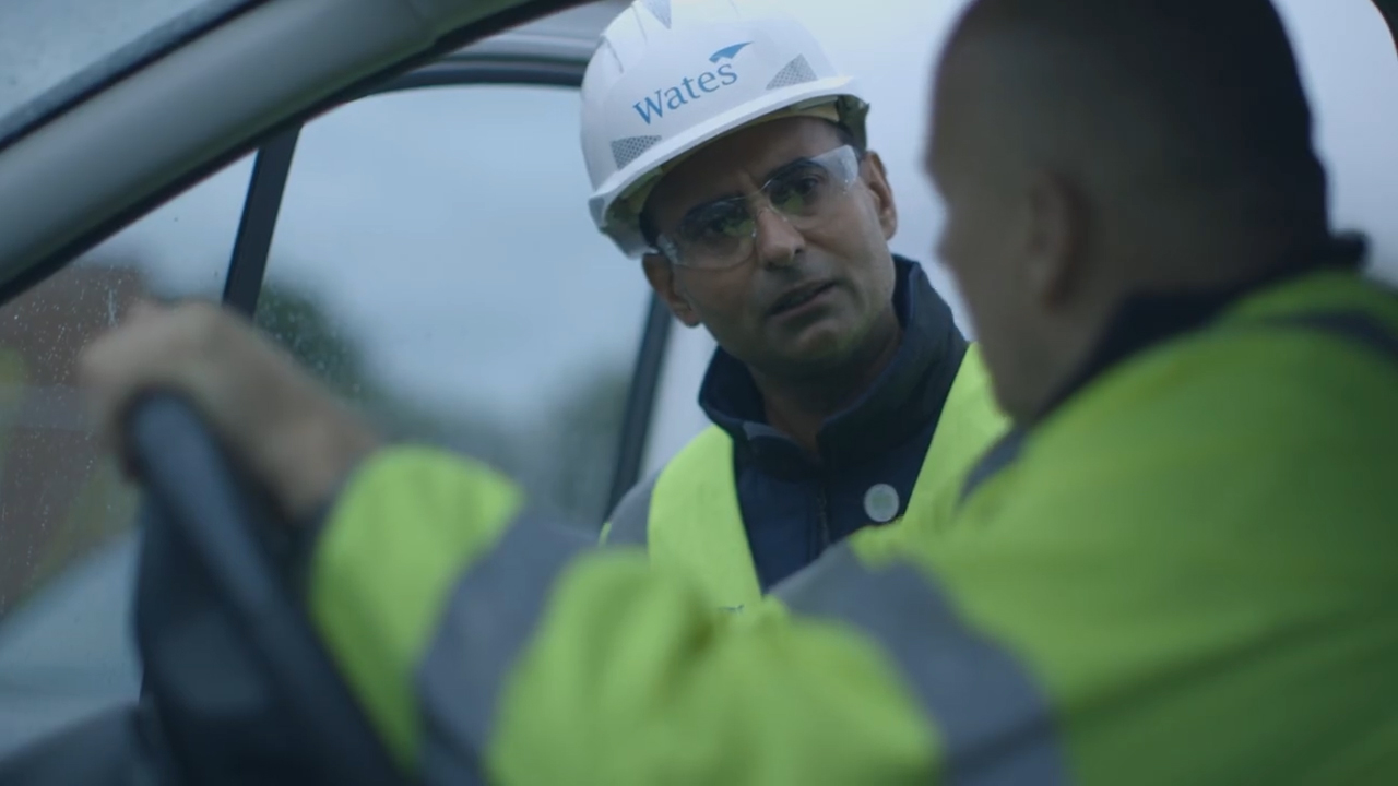 Two builders talking to each other