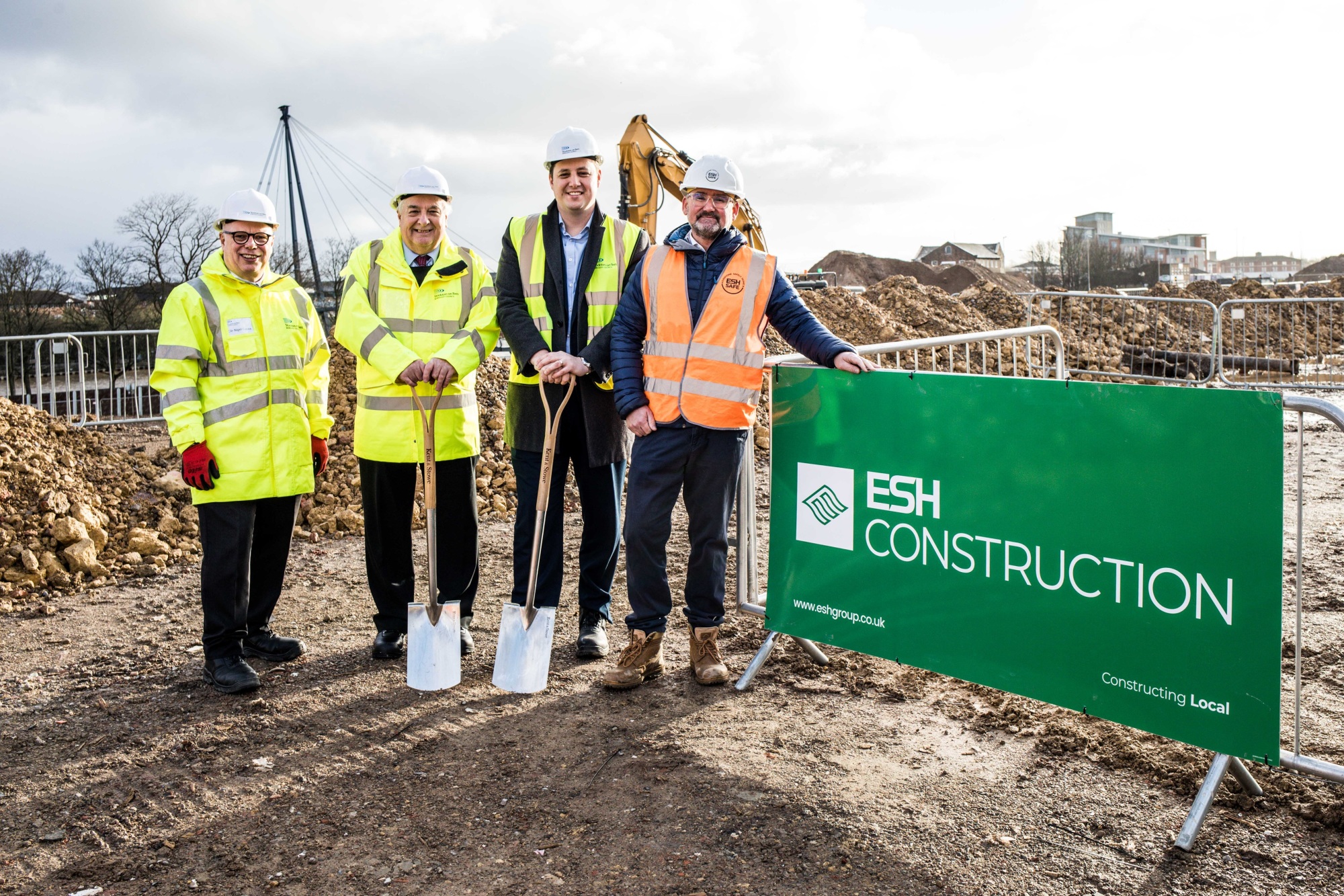 Construction workers in high vis at a building site in Stockton